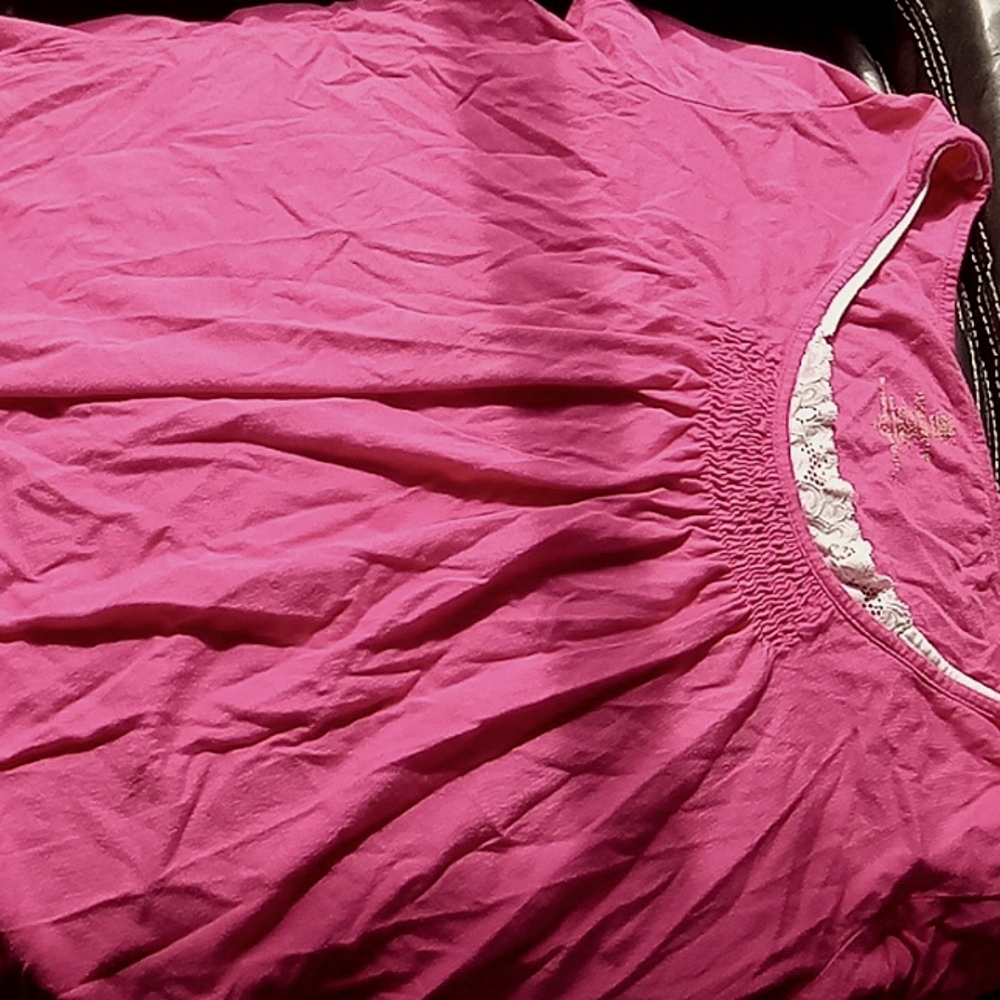 It's doesn't fit my mom anymore. It's a faded pink but it's still vibrant.